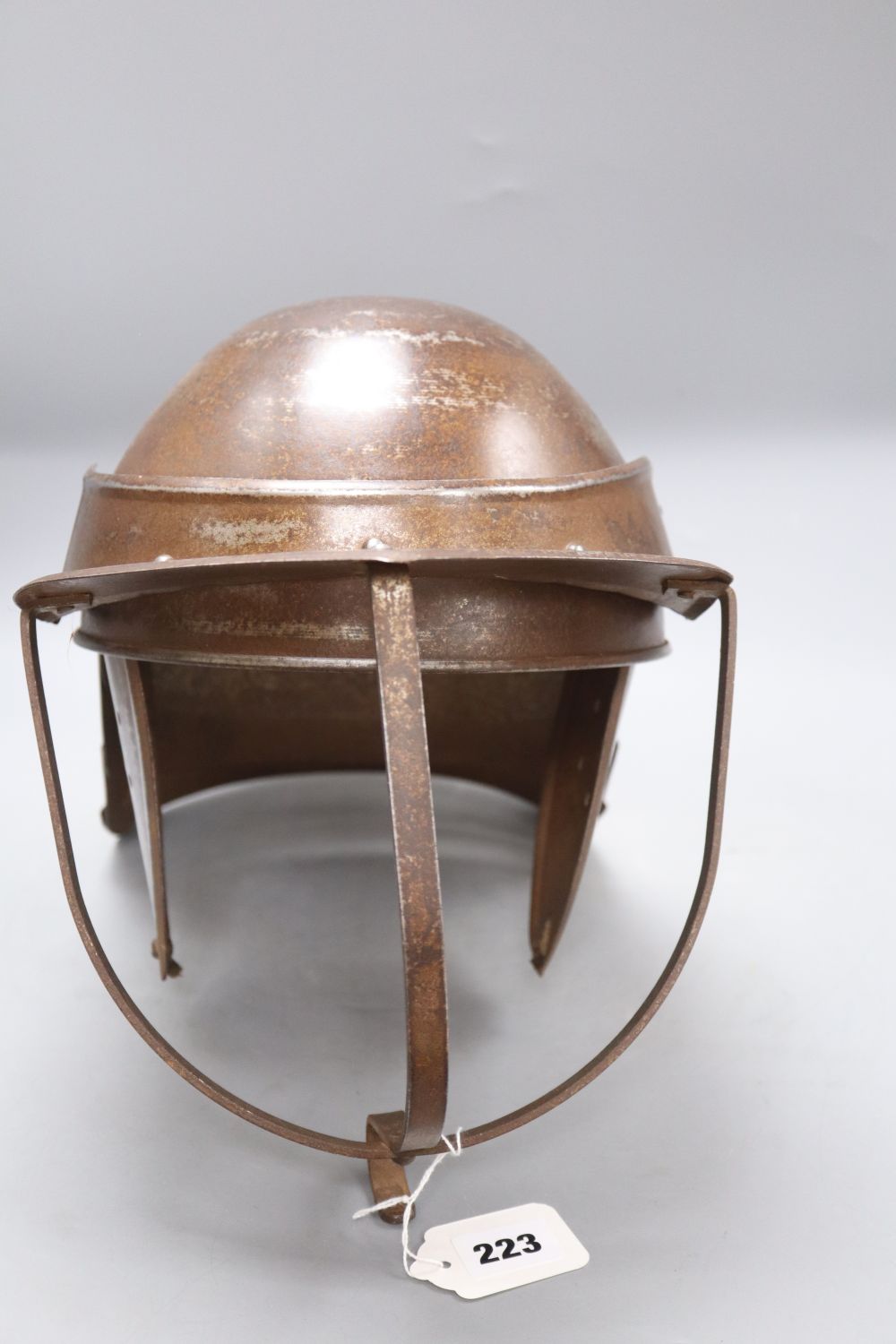 A reproduction English Civil War lobster tail helmet, length 49cm approx.